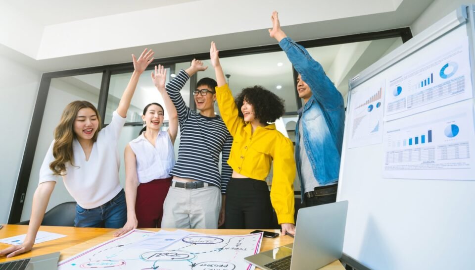 Group of asian young creative happy people entrepreneur on a business meeting office background Good leadership and teamwork lead to success